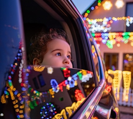 Child enjoying Christmas lights